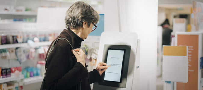 person using electronic kiosk