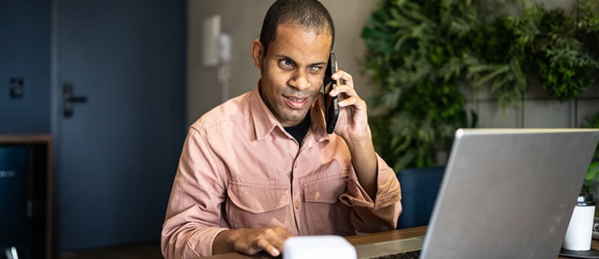 a visually impaired person talking on the phone