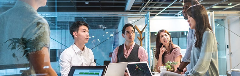 Coworkers in a modern office, depicting the context of the future of work.
