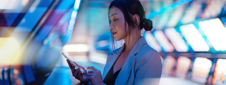 Young Asian business woman using smart phone in a Virtual Reality