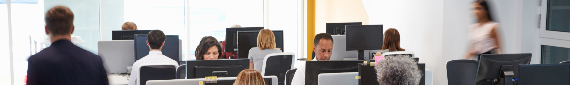 people working in a busy office