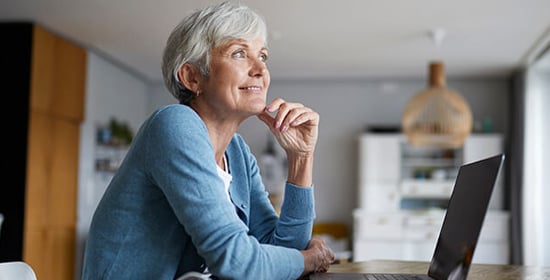 Woman working on her finances at home