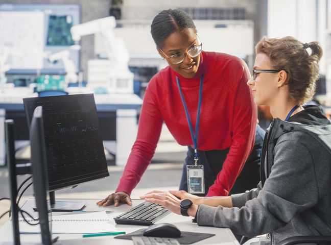 two people working on computer