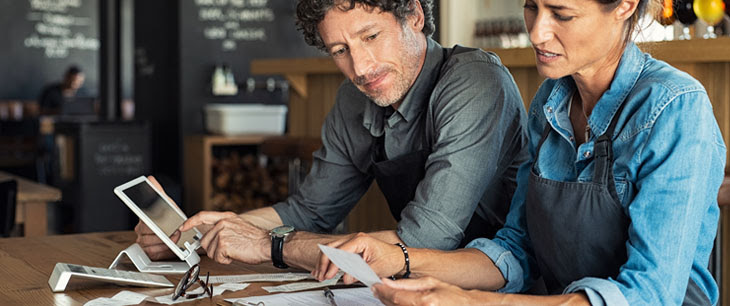 restaurant owners doing paperwork