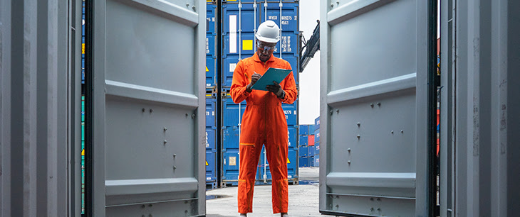 person looking into shipping container