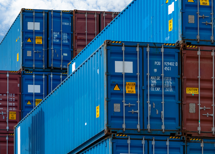 Close-up of blue and red shipping containers.
