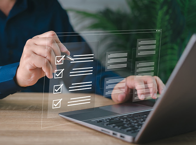 person checking off digital checklist
