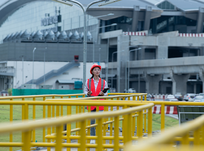 person walking through water plant