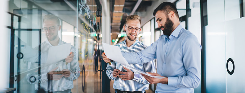 two people looking at financial papers