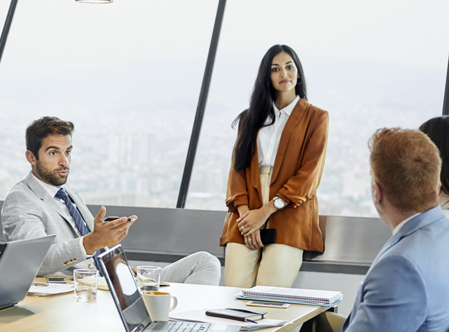 Woman leading a business meeting in a bright office