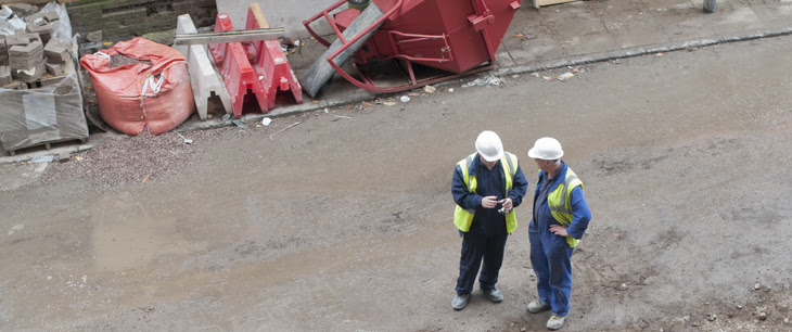 construction workers talking on site