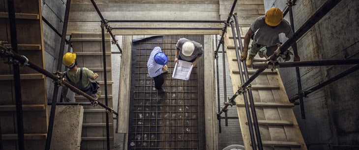 construction workers discussing plans