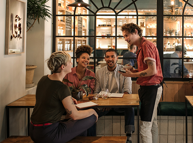 server taking orders at a restaurant